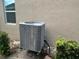 New AC unit installed outside, surrounded by lush greenery at 1166 Heron Sound Dr, Apopka, FL 32703