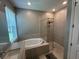 Primary bathroom boasts a soaking tub and glass enclosed shower at 1166 Heron Sound Dr, Apopka, FL 32703