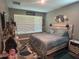 A serene bedroom features a queen-sized bed and coordinated decor at 1166 Heron Sound Dr, Apopka, FL 32703