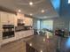 Modern kitchen featuring stainless steel appliances, granite countertops, and recessed lighting at 1166 Heron Sound Dr, Apopka, FL 32703