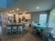 Spacious kitchen with white cabinets, granite countertops, and stainless steel appliances at 1166 Heron Sound Dr, Apopka, FL 32703