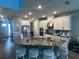 Well-equipped kitchen with a large island, granite countertops, and ample cabinet space at 1166 Heron Sound Dr, Apopka, FL 32703