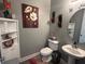 The powder room is tastefully decorated with modern fixtures and decor at 1166 Heron Sound Dr, Apopka, FL 32703