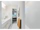 Elegant bathroom with double vanity, bright lighting, and a tiled walk-in shower at 13829 Destin Beach Ln, Orlando, FL 32827
