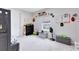 Bright, carpeted bedroom with toys, decor, and natural light creates an engaging and playful space at 13829 Destin Beach Ln, Orlando, FL 32827