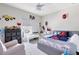 Bright bedroom features a bed, plush chair, and engaging toys and decor, creating a playful atmosphere at 13829 Destin Beach Ln, Orlando, FL 32827