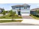 Charming two-story home featuring a two-car garage, manicured landscaping, and a welcoming entrance at 13829 Destin Beach Ln, Orlando, FL 32827