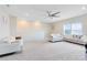 Spacious living room features carpeted floors, recessed lighting, and comfortable seating at 13829 Destin Beach Ln, Orlando, FL 32827