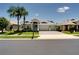 Charming single-story home with a three-car garage, well-maintained landscaping, and a paved driveway at 15521 Sandfield Loop, Winter Garden, FL 34787