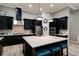 Well-equipped kitchen featuring a large island, modern appliances, and ample storage space at 15521 Sandfield Loop, Winter Garden, FL 34787
