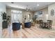Spacious living room with vaulted ceilings, lots of natural light, and an open floor plan at 15521 Sandfield Loop, Winter Garden, FL 34787