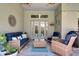 Charming screened-in patio featuring cozy seating, decorative elements, and an inviting atmosphere at 15521 Sandfield Loop, Winter Garden, FL 34787