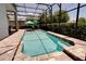 Sparkling screened-in pool with brick patio, offering a private and tranquil oasis for leisure at 15521 Sandfield Loop, Winter Garden, FL 34787