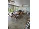 Bright and airy enclosed lanai with a ceiling fan, skylight, and space for dining or relaxing at 15683 Sw 46Th Cir, Ocala, FL 34473