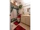 Cozy bathroom featuring a floral shower curtain, matching toilet cover, and a coordinated vanity with a large mirror at 1603 15Th, Sanford, FL 32771