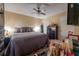 Bedroom showcasing hardwood floors, a ceiling fan, a comfortable bed, and dresser with decorative items at 1603 15Th, Sanford, FL 32771