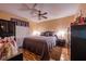 Comfortable bedroom with a ceiling fan, a gray quilt-covered bed, and wood-look flooring, creating a cozy and inviting space at 1603 15Th, Sanford, FL 32771