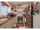 Efficient kitchen with white cabinetry, stainless steel appliances, and laminated countertops at 1603 15Th, Sanford, FL 32771