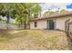 Spacious backyard featuring a mix of sunny and shaded areas, bordered by a chain-link and wooden fence at 1710 Espanola Ave, Daytona Beach, FL 32117