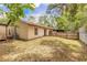 Well-sized backyard featuring a fenced perimeter for privacy and an air conditioning unit at 1710 Espanola Ave, Daytona Beach, FL 32117
