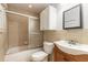 Cozy bathroom featuring a tiled shower, updated vanity, and ample storage space at 1710 Espanola Ave, Daytona Beach, FL 32117