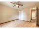 A light-filled bedroom features tile flooring, a ceiling fan, and a closet at 1710 Espanola Ave, Daytona Beach, FL 32117