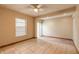 Bright bedroom with tile flooring, large window, and a sliding glass door for natural light at 1710 Espanola Ave, Daytona Beach, FL 32117