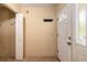 A well-lit entryway featuring a closet and tiled flooring at 1710 Espanola Ave, Daytona Beach, FL 32117