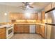 Functional kitchen with modern appliances and wooden cabinets at 1710 Espanola Ave, Daytona Beach, FL 32117