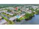 Scenic aerial view featuring apartments, a swimming pool, and waterway access, ideal for relaxation at 202 Georgetown Dr # C, Casselberry, FL 32707