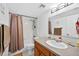 Standard bathroom with shower-tub combo, large mirror, and vanity sink at 202 Georgetown Dr # C, Casselberry, FL 32707