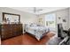 Bedroom featuring ceiling fan, a dark wood dresser, and good natural lighting at 202 Georgetown Dr # C, Casselberry, FL 32707