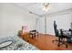 Bedroom featuring wood floors, a ceiling fan, and a closet for storage at 202 Georgetown Dr # C, Casselberry, FL 32707