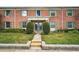 Red brick building with lush green landscaping at 202 Georgetown Dr # C, Casselberry, FL 32707