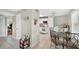 Bright, tiled kitchen adjacent to a dining area with modern appliances at 202 Georgetown Dr # C, Casselberry, FL 32707