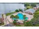 Community pool overlooking a serene lake at 202 Georgetown Dr # C, Casselberry, FL 32707