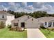 Beautiful aerial view of home with landscaped yard and driveway at 2043 Rock Maple Bnd, Kissimmee, FL 34746