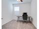 Bright bedroom featuring a desk and a minimalist setup; ideal for focus and productivity at 2043 Rock Maple Bnd, Kissimmee, FL 34746
