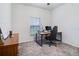 Well-lit bedroom featuring a desk and a large window; ideal for a home office at 2043 Rock Maple Bnd, Kissimmee, FL 34746