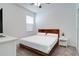 Cozy bedroom with hardwood bed frame and ample natural light; perfect for relaxation at 2043 Rock Maple Bnd, Kissimmee, FL 34746