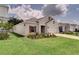 Charming single-Gathering home with fresh landscaping, well-manicured lawn and two-car garage at 2043 Rock Maple Bnd, Kissimmee, FL 34746