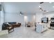 Spacious open-concept living area with kitchen island, stainless appliances, and comfortable seating at 2043 Rock Maple Bnd, Kissimmee, FL 34746