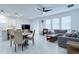Open-concept living room and dining area, with tile floors and a large window overlooking the backyard at 2043 Rock Maple Bnd, Kissimmee, FL 34746