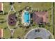 Aerial view of community pool, playground, clubhouse, and green space at 2122 Bent Grass Ave, Ocoee, FL 34761