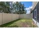 Fenced backyard with a patch of grass, offering privacy and space at 2122 Bent Grass Ave, Ocoee, FL 34761