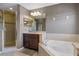 Bathroom boasting soaking tub, glass shower, and vanity with great lighting at 2122 Bent Grass Ave, Ocoee, FL 34761