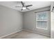 Bedroom featuring a ceiling fan, a window with blinds, and neutral colored walls at 2122 Bent Grass Ave, Ocoee, FL 34761