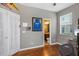 Bedroom featuring hardwood floors, and an ensuite bathroom at 2122 Bent Grass Ave, Ocoee, FL 34761