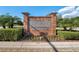 Brick community sign with lush landscaping at 2122 Bent Grass Ave, Ocoee, FL 34761