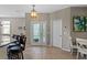 Open foyer with tile flooring, pendant lighting, and a decorative glass front door at 2122 Bent Grass Ave, Ocoee, FL 34761